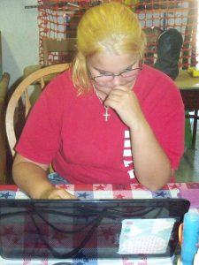 Photo of Stephanie writing her portion of this post.